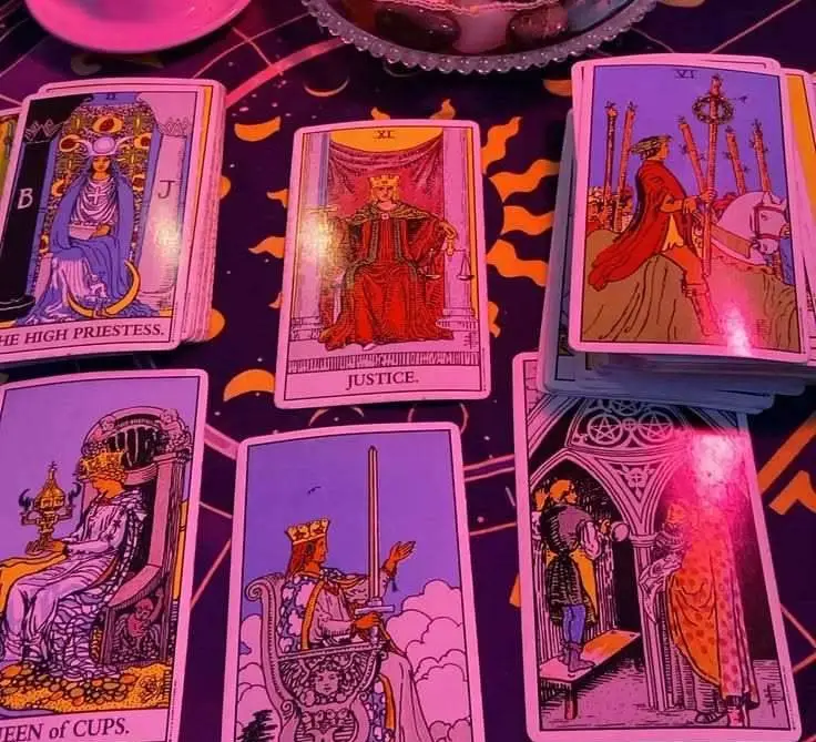 Love Reading in USA - Tarot cards spread on a zodiac cloth for a love reading