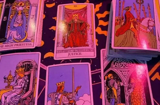 Love Reading in USA - Tarot cards spread on a zodiac cloth for a love reading