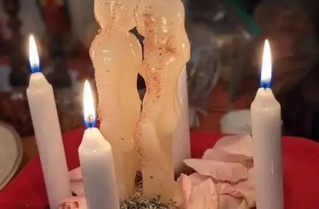 Marriage and Relationship Harmony in USA - White couple candle surrounded by white candles and rose petals