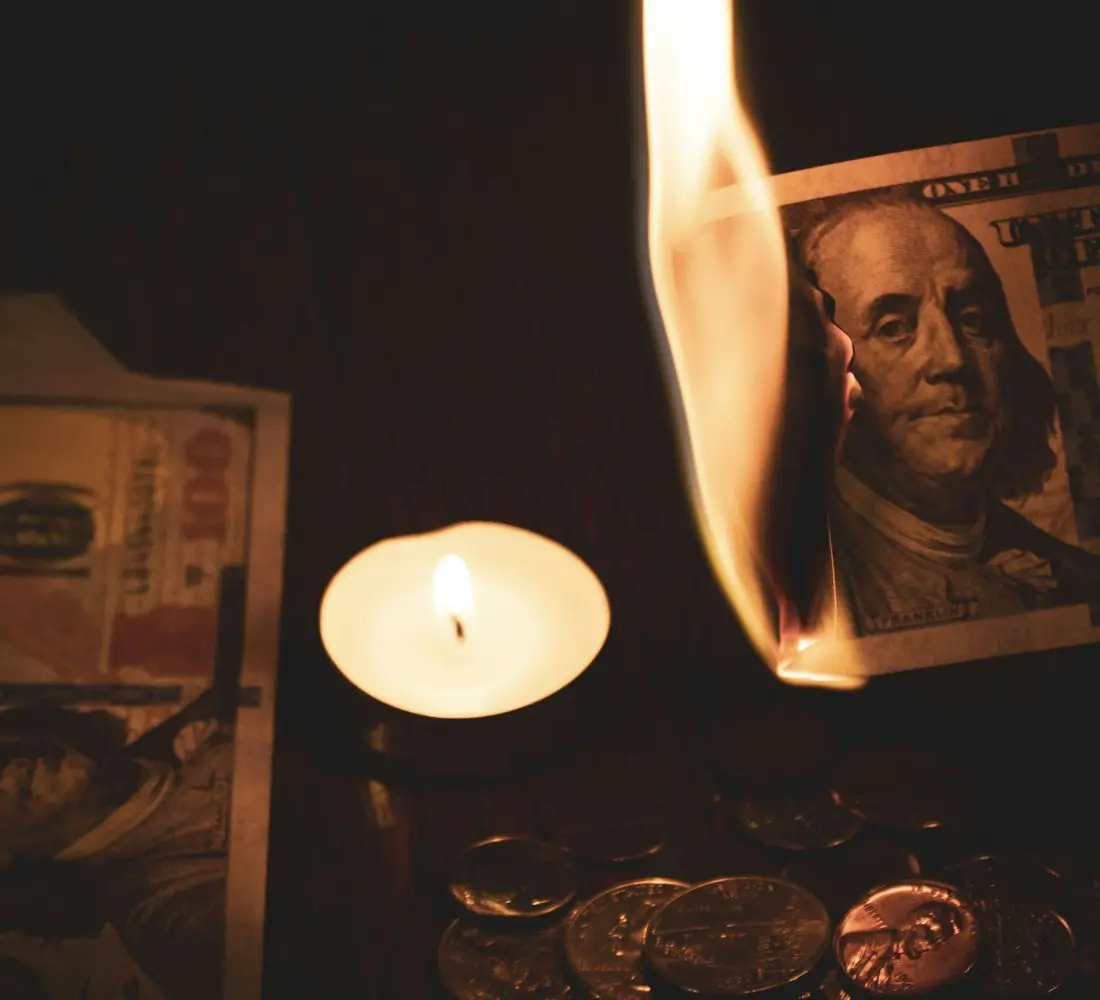 Money and Prosperity Rituals in USA - Candle beside money for a prosperity ritual