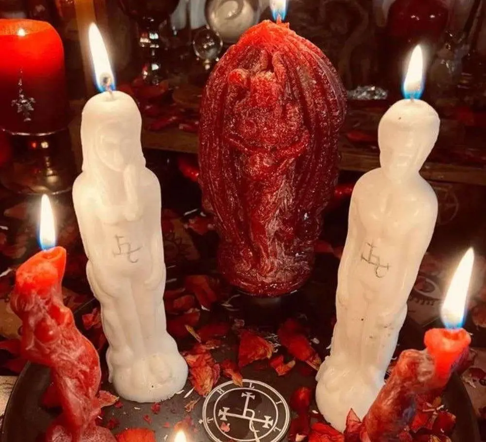 Our Spiritual Services in USA - Red and white figure candles on a ritual altar