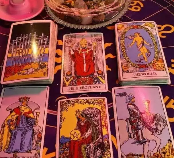 Vedic Astrology and Love Compatibility in USA - Tarot cards laid on a zodiac chart cloth