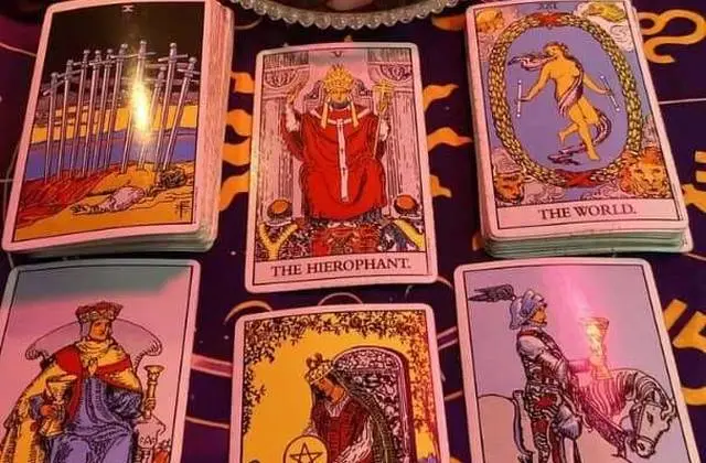 Vedic Astrology and Love Compatibility in USA - Tarot cards laid on a zodiac chart cloth